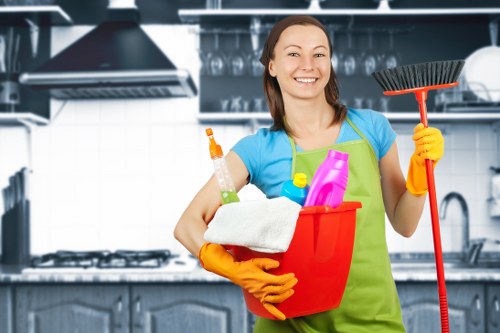 Professional cleaner in Watford preparing a kitchen and bathroom