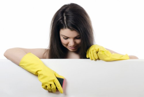 Deep cleaning a living room armchair with specialist upholstery equipment