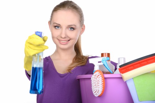 Cleaner wearing PPE while carrying out a risk-assessed cleaning job